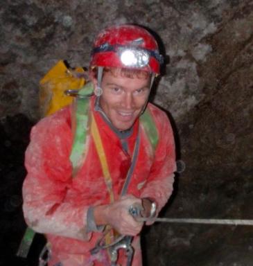 Image of Dr. Daniel Jones in a cave